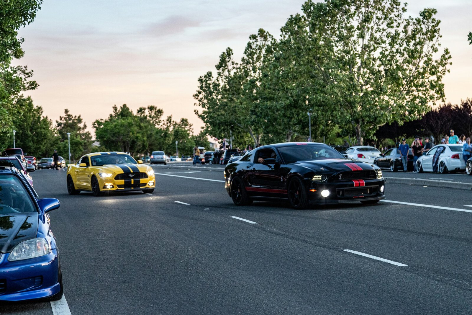 black sedan on road during daytime